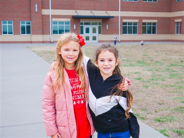 two girls smiling